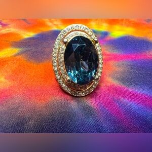 Blue crystal gold tone ring with faux diamonds